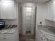 View of pantry with shelving and bi-fold doors, located in the kitchen at 405 Lemonwood Dr, Englewood, FL 34223