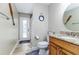 Cozy bathroom featuring granite countertops and a decorative nautical themed design at 447 Bridle Path Way, Tarpon Springs, FL 34688
