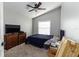 This bedroom has wall to wall carpet and a large window for natural light at 447 Bridle Path Way, Tarpon Springs, FL 34688