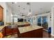 Gourmet kitchen with stainless-steel appliances, large island, breakfast bar, and open floor plan at 447 Bridle Path Way, Tarpon Springs, FL 34688