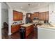 Spacious kitchen with custom cabinets, granite countertops, and stainless-steel appliances at 447 Bridle Path Way, Tarpon Springs, FL 34688