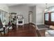 Bright living room with dark wood flooring, fireplace, and shelving at 447 Bridle Path Way, Tarpon Springs, FL 34688
