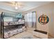 Bedroom with bunk beds, tile floors, a playful dart board, and a bright ceiling fan at 4818 Holiday Dr, Tampa, FL 33615
