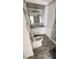 Well-lit bathroom with sink vanity and built-in linen closet at 4851 W Gandy Blvd # B7L23, Tampa, FL 33611