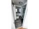 Bathroom with sink vanity, shower and gray wood-look floors at 4851 W Gandy Blvd # B7L23, Tampa, FL 33611