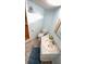 Compact bathroom with single sink vanity, toilet, and light blue walls at 4851 W Gandy Blvd # B7L23, Tampa, FL 33611