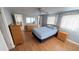 Cozy bedroom featuring hardwood floors, ceiling fan, and neutral wall color at 4851 W Gandy Blvd # B7L23, Tampa, FL 33611