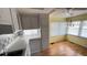Bright dining room with laminate flooring, ample lighting, and open layout at 4851 W Gandy Blvd # B7L23, Tampa, FL 33611