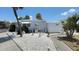 This is a well-kept home with a white exterior, decorative accents and gravel landscaping at 4851 W Gandy Blvd # B7L23, Tampa, FL 33611