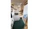 Functional laundry room featuring washer, sink, and storage solutions at 4851 W Gandy Blvd # B7L23, Tampa, FL 33611