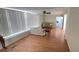 Bright living room featuring wood-look flooring, ceiling fan, and two comfortable sofas at 4851 W Gandy Blvd # B7L23, Tampa, FL 33611