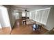 Bright living room with wood floors, neutral walls, and ample natural light from large windows at 4851 W Gandy Blvd # B7L23, Tampa, FL 33611