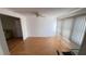 Versatile room showcasing wood-look floors and views of the living area at 4851 W Gandy Blvd # B7L23, Tampa, FL 33611