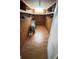 Spacious walk-in closet with ample shelving and laminate floors at 4851 W Gandy Blvd # B7L23, Tampa, FL 33611