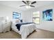 Bright bedroom with ceiling fan, natural light, neutral walls and carpeted floors at 5580 S Salford Blvd, North Port, FL 34287