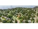 Stunning aerial perspective of a residence surrounded by lush trees, offering a serene and secluded atmosphere at 5800 3Rd S St, St Petersburg, FL 33705