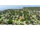 Serene aerial view of a property nestled among lush greenery near a tranquil bay, showcasing peaceful neighborhood setting at 5800 3Rd S St, St Petersburg, FL 33705