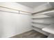 Walk-in closet features a hanging rod and multiple built-in shelving units at 5800 3Rd S St, St Petersburg, FL 33705