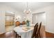 Spacious dining area featuring hardwood floors and chandelier lighting at 5800 3Rd S St, St Petersburg, FL 33705