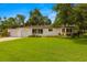 Well-maintained home with a manicured lawn, 2-car garage, and attractive landscaping at 5800 3Rd S St, St Petersburg, FL 33705
