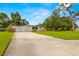 Attractive single-Gathering home with a long driveway and a well-manicured lawn at 5800 3Rd S St, St Petersburg, FL 33705