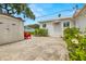 Quaint single-story home featuring a well-maintained yard and convenient storage shed at 5800 3Rd S St, St Petersburg, FL 33705