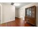 Bright hallway featuring hardwood floors and interior doors and a hutch at 5800 3Rd S St, St Petersburg, FL 33705