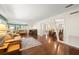 Spacious living room with hardwood floors, a comfortable leather sofa, and elegant decor at 5800 3Rd S St, St Petersburg, FL 33705