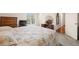 Bright bedroom with large window and dresser plus a comfy-looking bed and access to a bathroom at 5800 3Rd S St, St Petersburg, FL 33705