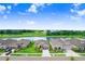 Community aerial showcasing pond view homes, green lawns and sidewalks in a desirable neighborhood at 6097 Golden Nettle Dr, Apollo Beach, FL 33572