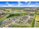 A scenic aerial view of the home within a community featuring lakes and green fields at 6097 Golden Nettle Dr, Apollo Beach, FL 33572