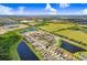A beautiful aerial view of the home in a neighborhood surrounded by serene lakes and lush greenery at 6097 Golden Nettle Dr, Apollo Beach, FL 33572