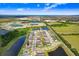 A picturesque aerial view of the home near to lakes and expansive green fields at 6097 Golden Nettle Dr, Apollo Beach, FL 33572