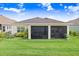 Home featuring a screened lanai perfect for entertaining and relaxing, with a lush green lawn at 6097 Golden Nettle Dr, Apollo Beach, FL 33572