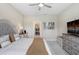 Bedroom with TV, dresser, and walk-in closet at 6097 Golden Nettle Dr, Apollo Beach, FL 33572