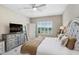 Calming bedroom with neutral tones, plush bedding, and a window with a scenic view at 6097 Golden Nettle Dr, Apollo Beach, FL 33572