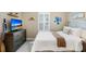 Comfortable bedroom showcasing a large bed and mounted television at 6097 Golden Nettle Dr, Apollo Beach, FL 33572