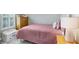 Cozy bedroom featuring a plush bed, a dresser, and a decorative toy box at 6097 Golden Nettle Dr, Apollo Beach, FL 33572