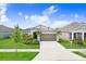 Charming single-Gathering home with a well-manicured lawn, two car garage and tasteful landscaping at 6097 Golden Nettle Dr, Apollo Beach, FL 33572