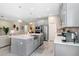 Well-equipped kitchen with an island, stainless steel appliances, and an open layout connecting to the living space at 6097 Golden Nettle Dr, Apollo Beach, FL 33572