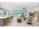 Bright, open-concept living room with modern furnishings and a view of the outdoors at 6097 Golden Nettle Dr, Apollo Beach, FL 33572