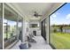 Beautiful screened-in patio with outdoor kitchen and lake views, ideal for relaxing at 6097 Golden Nettle Dr, Apollo Beach, FL 33572