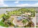 Aerial view of community playground and picnic area near a lake, perfect for outdoor Gathering activities at 6097 Golden Nettle Dr, Apollo Beach, FL 33572