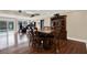 Dining room area with hardwood floors, built in cabinetry and sliding glass door at 6219 Wendell Dr, Wesley Chapel, FL 33544