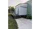 Exterior view of restrooms attached to a metal building with handicap ramp access at 6219 Wendell Dr, Wesley Chapel, FL 33544