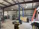 Interior of large metal building featuring equipment, tools, and plentiful metal stock at 6219 Wendell Dr, Wesley Chapel, FL 33544