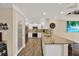 Bright kitchen featuring granite countertops, stainless steel appliances and pantry at 6219 Wendell Dr, Wesley Chapel, FL 33544