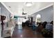 Spacious room with many work stations, natural light, and ceiling fan at 6219 Wendell Dr, Wesley Chapel, FL 33544