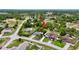 Aerial view highlights the home, storage shed, and neighborhood at 6310 Gainsboro Ave, Spring Hill, FL 34609