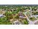 Aerial view of a charming home and its spacious lot outlined in red at 6310 Gainsboro Ave, Spring Hill, FL 34609